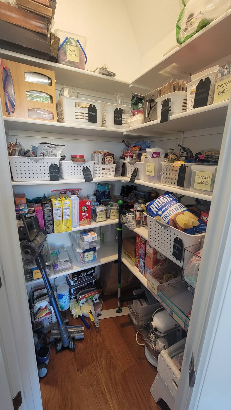 A corner pantry with food and appliances stacked at random, then the same pantry with categories grouped into bins on labeled shelves